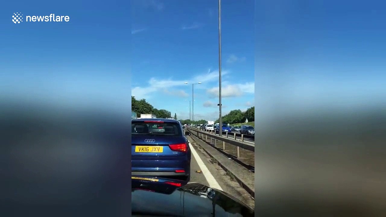 Air ambulance circles the M4 outside London after a major crashing involving 3 vehicles