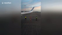 Ryanair workers caught on camera playing 'cone flip' game on runway at Prague airport