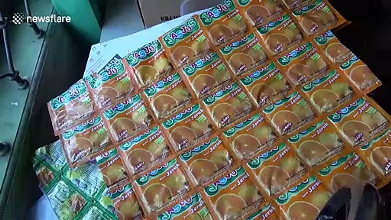 Sewing plastic waste into bags and aprons in Indonesia