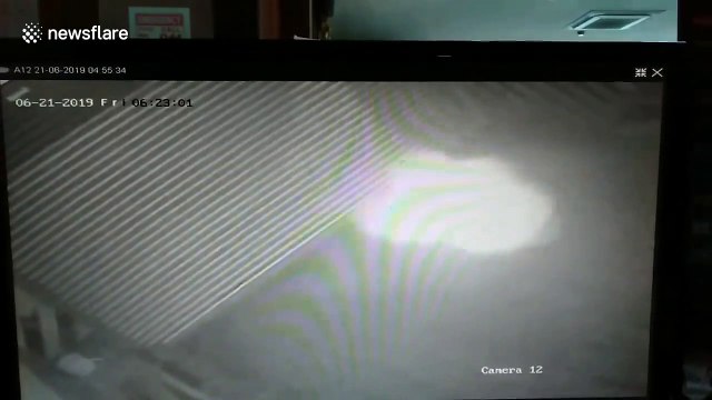 Spooky glowing 'ghost' captured on CCTV trapped inside car park