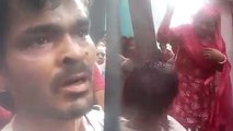 VIDEO: मोबाइल चोरी के आरोपी में महिला ने युवक को खम्भे से बांधकर बेल्ट से की पिटाई