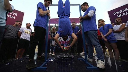Watch: Student breaks upside down Rubik's Cube record
