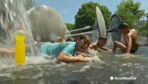 These kids have the right idea when it comes to finding relief in the heat