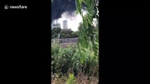 Huge clouds of black smoke rise from fire at industrial plant in Spain's San Roque