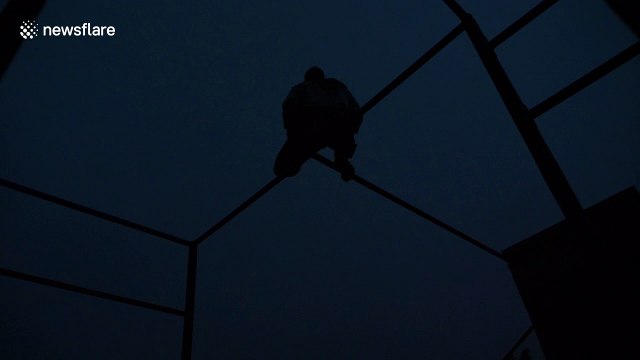 Free runner strikes a pose perfectly as bolts of lightning ignite the sky