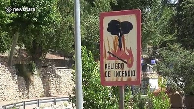 Residents in Spain use fountains to cool down amid European heatwave