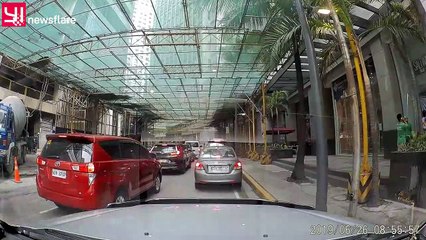 Shocking moment crane full of cement plunges from 34th floor of tower block onto cars in the Philippines