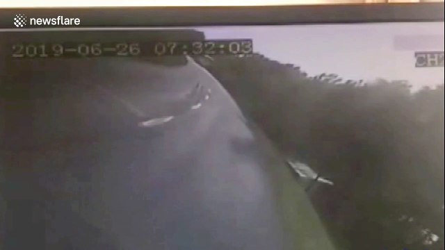 Truck knocks shuttle bus off road killing 2 and injuring 13 in China's Daqing