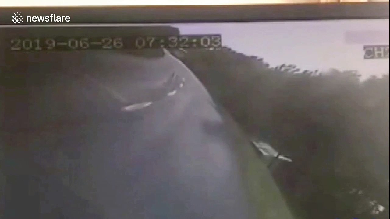 Truck knocks shuttle bus off road killing 2 and injuring 13 in China's Daqing