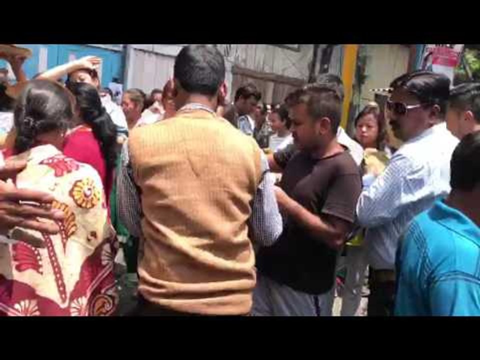 Nepalese natives of Darjeeling feed Bengali tourists