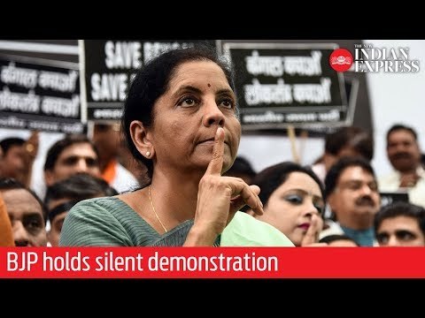 BJP holds silent demonstration to protest clashes at Amit Shah's roadshow