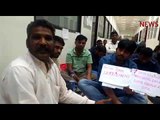 Unpaid for months, Indian workers sit in protest outside Kharafi National office