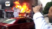 اللقطات الأولى من موقع حريق معرض ملابس  في شارع العريش بالهرم