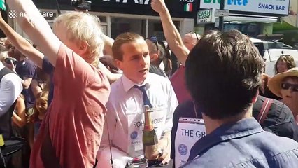 Waiters in London's Soho compete in traditional champagne street race