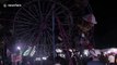 Terrifying scenes as Indonesian fairground goers become stranded on ferris wheel
