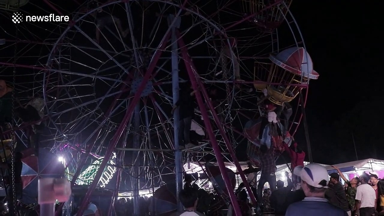 Terrifying scenes as Indonesian fairground goers become stranded on ferris wheel