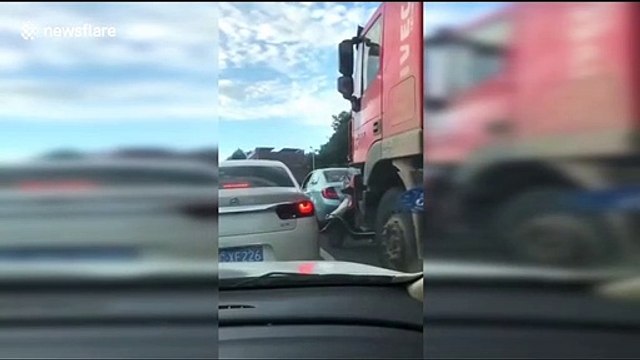 Woman riding a scooter narrowly survives being run over by a truck in China