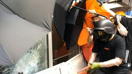 Hong Kong protesters smash their way into parliament