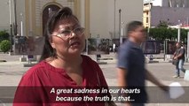 Salvadorans react after deceased migrant father, child buried