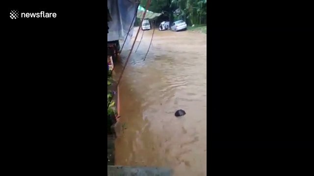 Students stranded inside classrooms after flash flooding in the Philippines