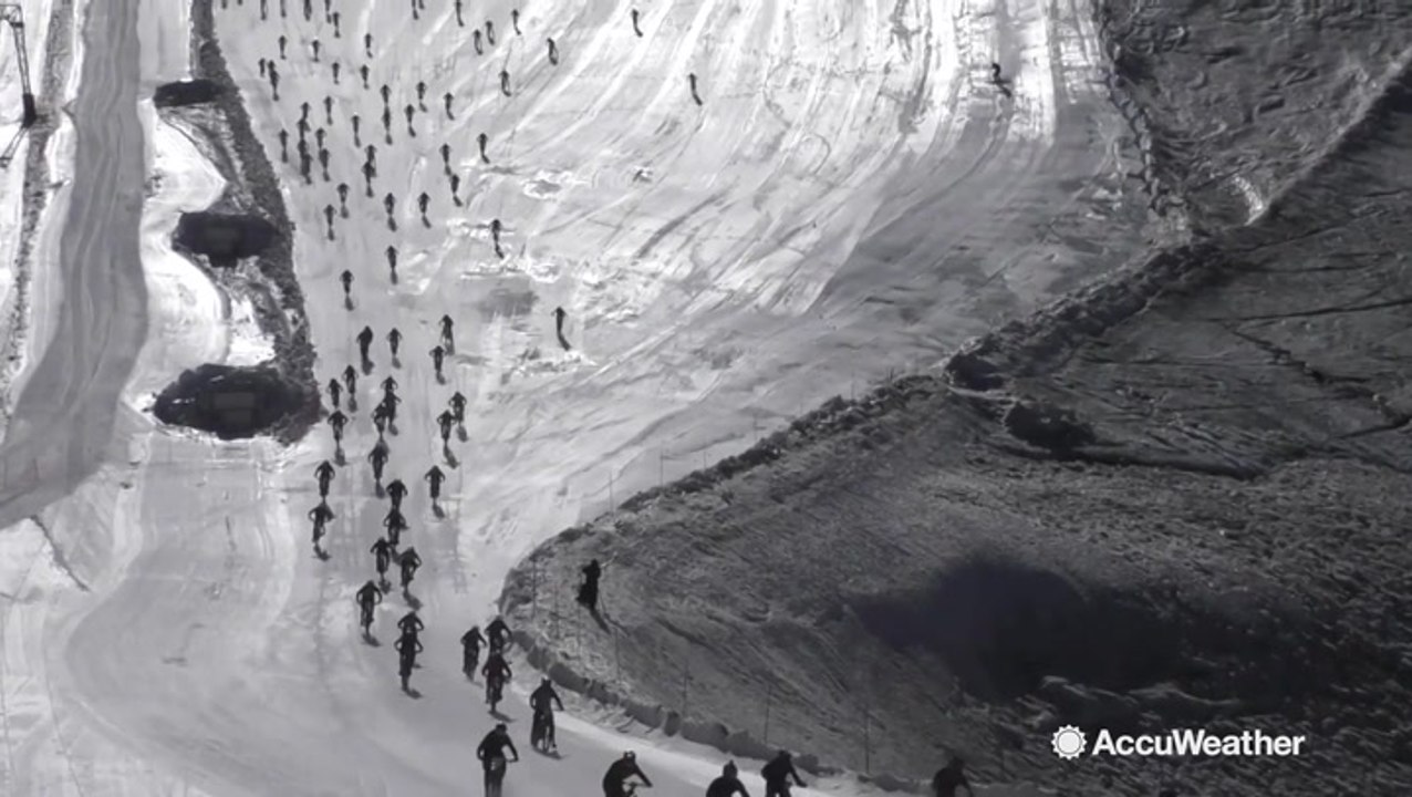 Biking down an icy slope goes as you would expect it for several riders