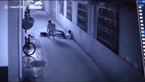 Heroic policeman saves suicidal woman by breaking her fall in China