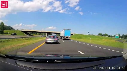 Semi Nearly Smashes into Silver Sports Car