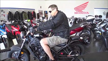 190cm man seating on HONDA REBEL 500cc cruiser 2019