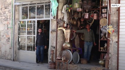 Aleppo's ancient coppersmiths' market comes back to life after restorations