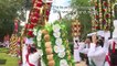 A procession of flowered crowns crosses the Portuguese city of the Knights Templar