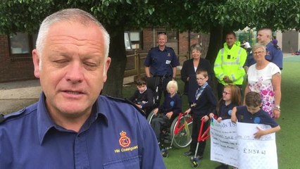 Shoreham Coastguard beach wheechair cheque