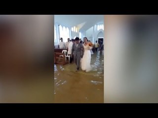 For wetter or worse: Philippine bride defies storm