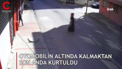 Otomobilin altında kalmaktan son anda kurtuldu
