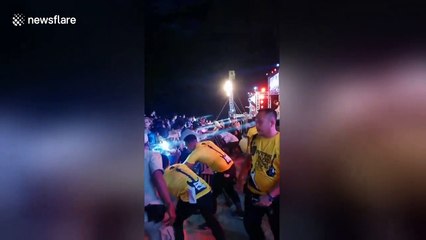Audience goes wild for Thai rock singer who goes crowd surfing