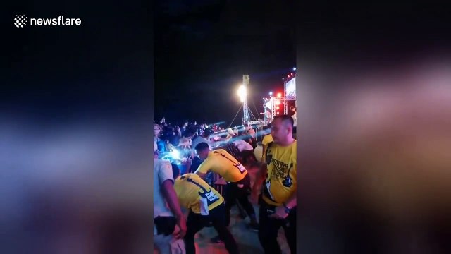 Audience goes wild for Thai rock singer who goes crowd surfing