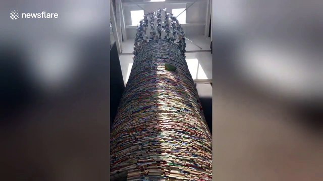 Textbooks weighing 14 tonnes built into 11-metre-high book tower in China's Xi'an