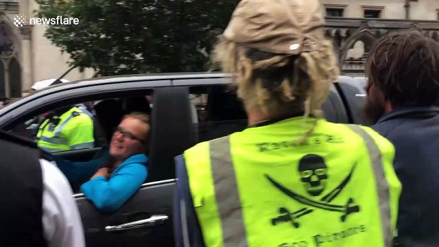 Cheers ring out as blue boat unveiled at London Extinction Rebellion protest