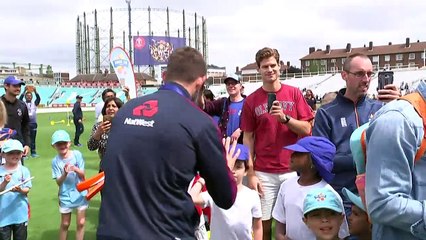 England's cricket team celebrate with fans after victory