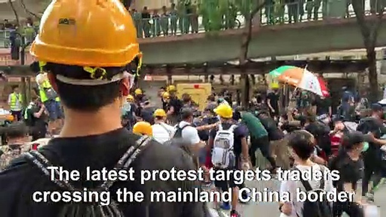Clashes as Hong Kong protesters vent at China border traders