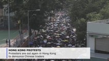 Protesters out again in Hong Kong to denounce Chinese traders