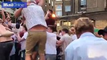 Fans celebrate England's Cricket World Cup win at the George Inn