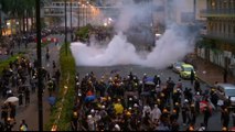 Hong Kong police draw guns, use water cannon in clashes