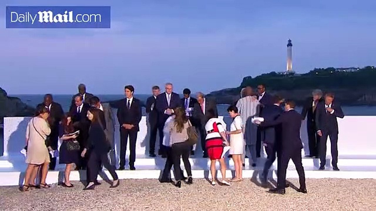 World leaders exchange greetings as they arrive for G7 dinner