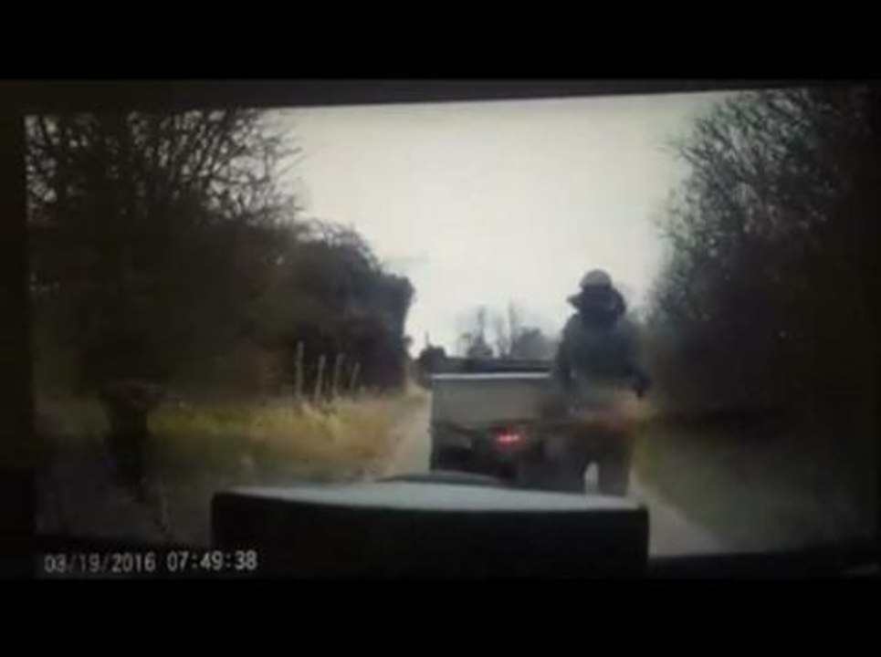 Masked men attack car with spades