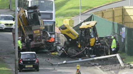 One dead after digger crashes onto car