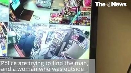 Shop worker tackles robber