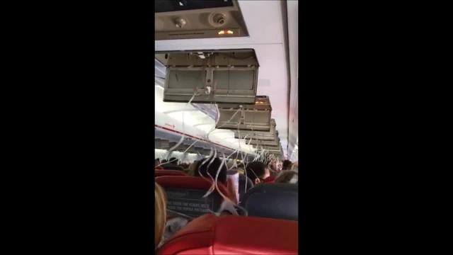 WATCH: Mother films terrifying scene inside plane as it dropped towards the sea.