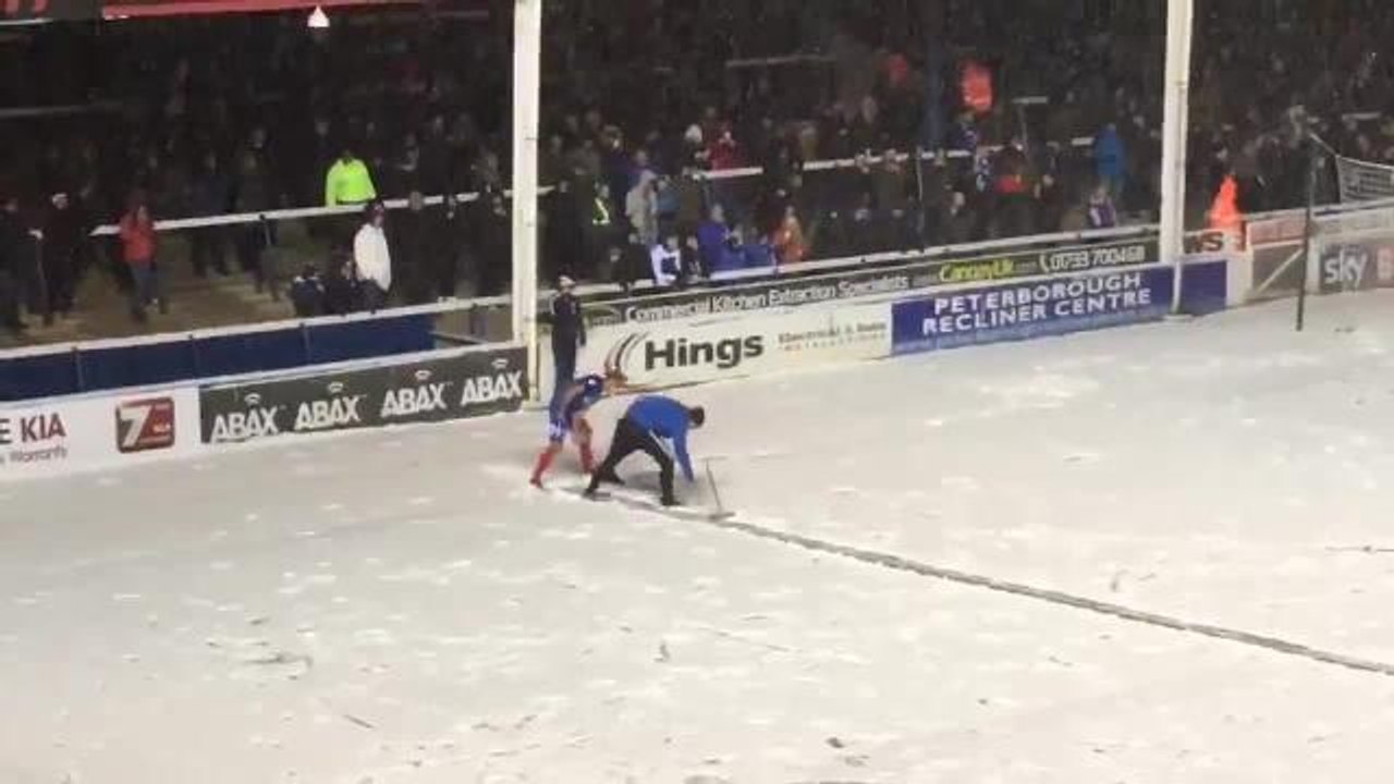 Peterborough United clearing snow