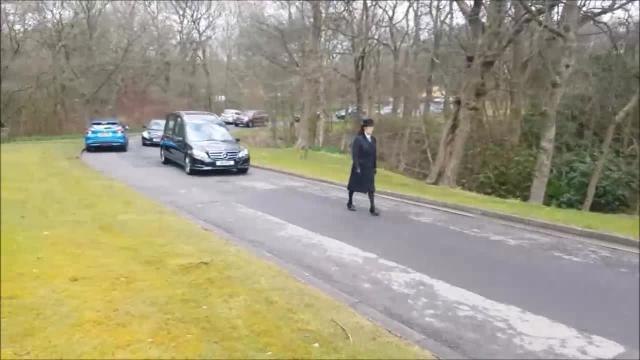 Trevor Howard's four Afghan Hounds lead the hearse out at his funeral at Burnley Crematorium.
