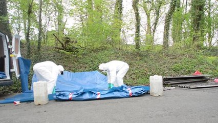 Clean-up after asbestos dumped on country lane